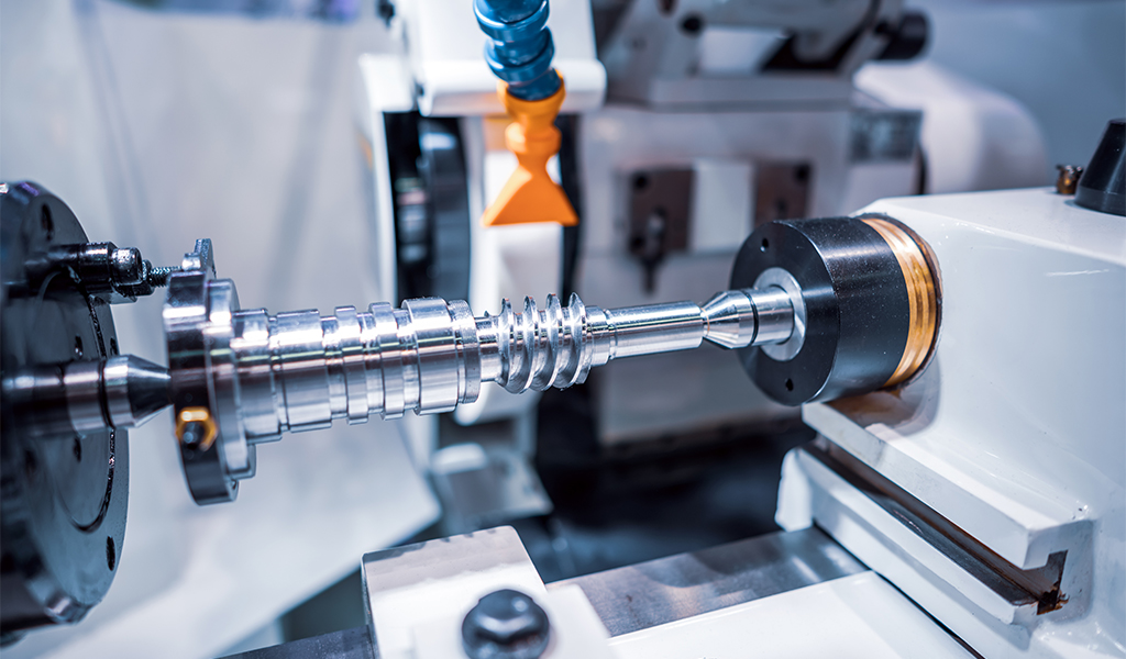 Metalworking CNC milling machine. Cutting metal modern processing technology. Small depth of field. Warning - authentic shooting in challenging conditions. A little bit grain and maybe blurred.